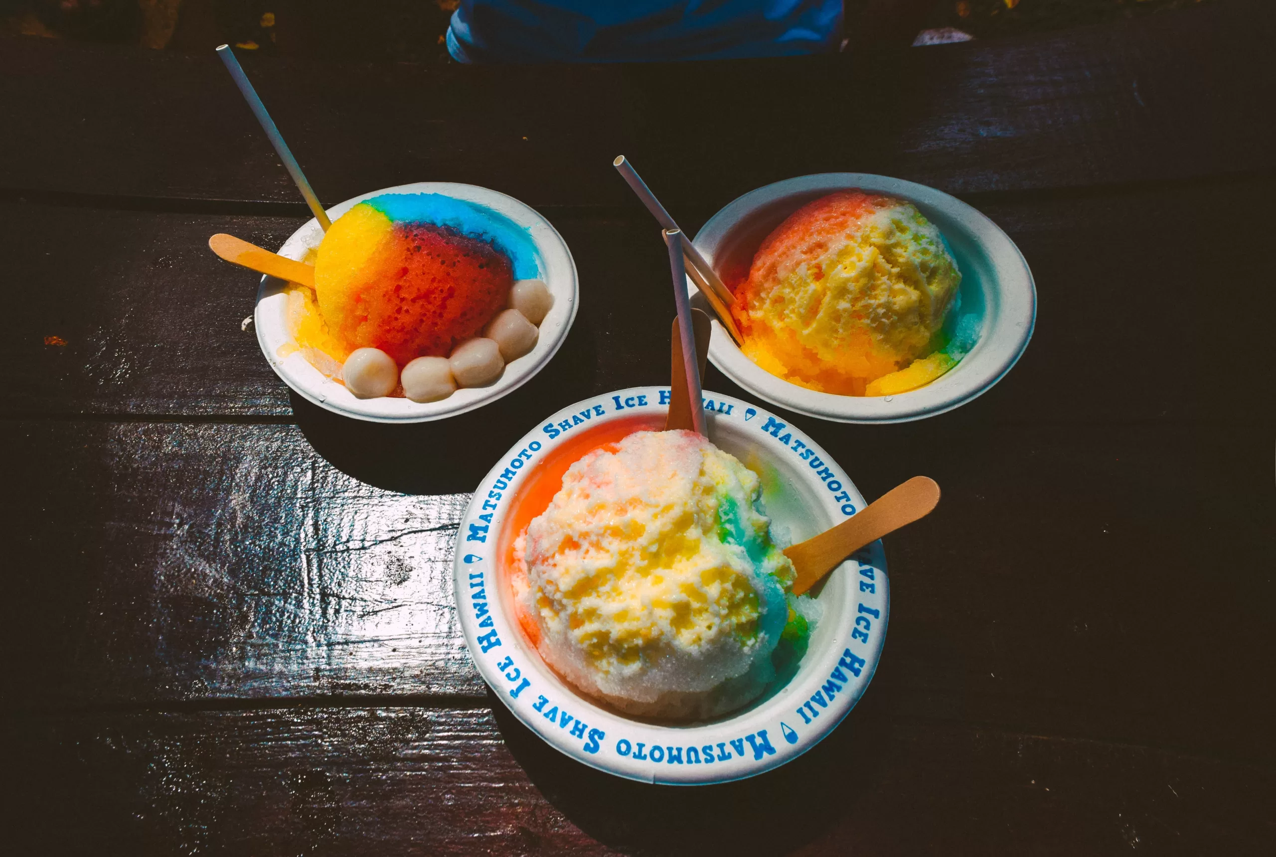 Three bowls with colourful Hawaiian shave ice