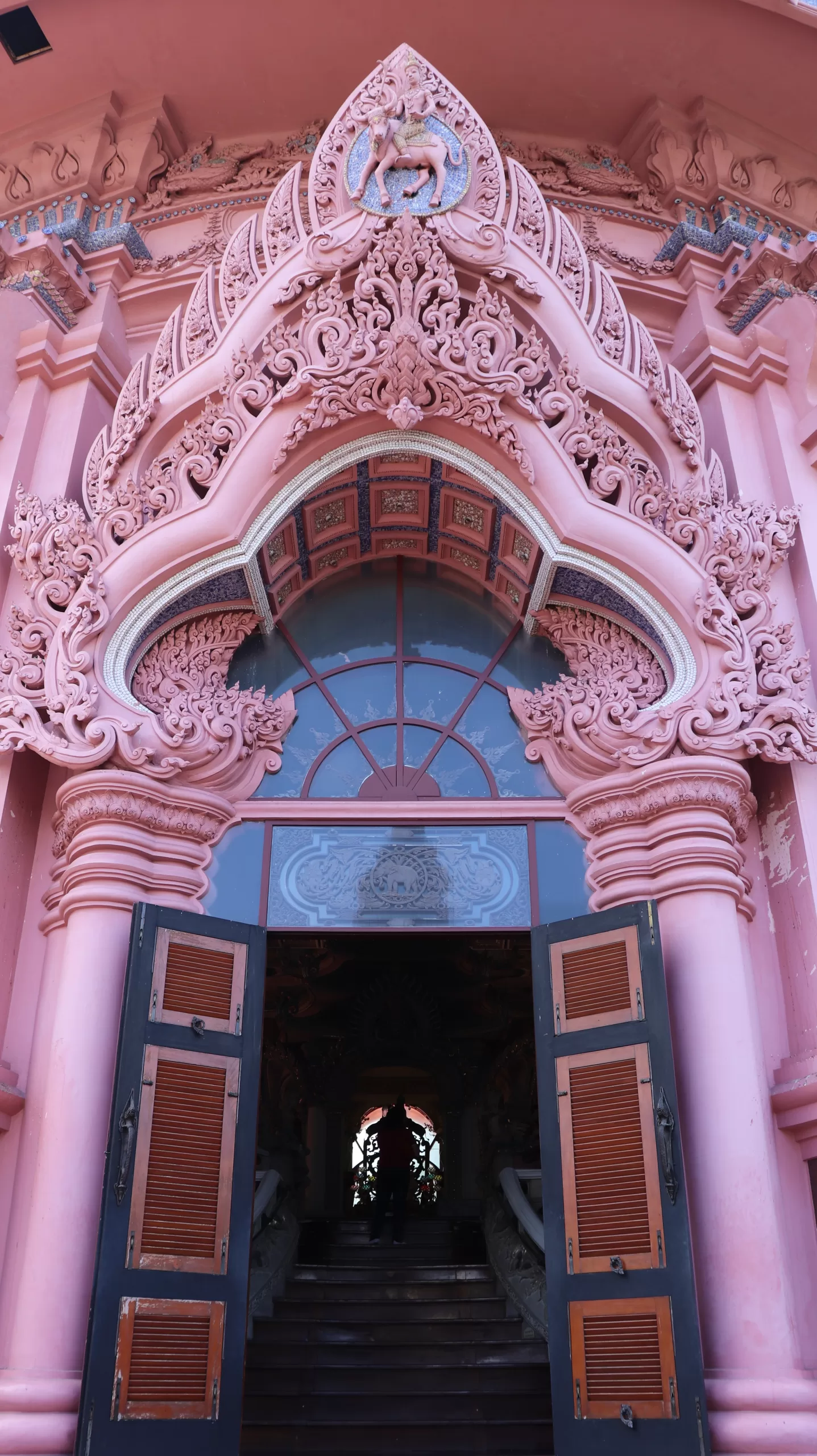 Detailed architecture of the Erawan Museum's grand arched entrance